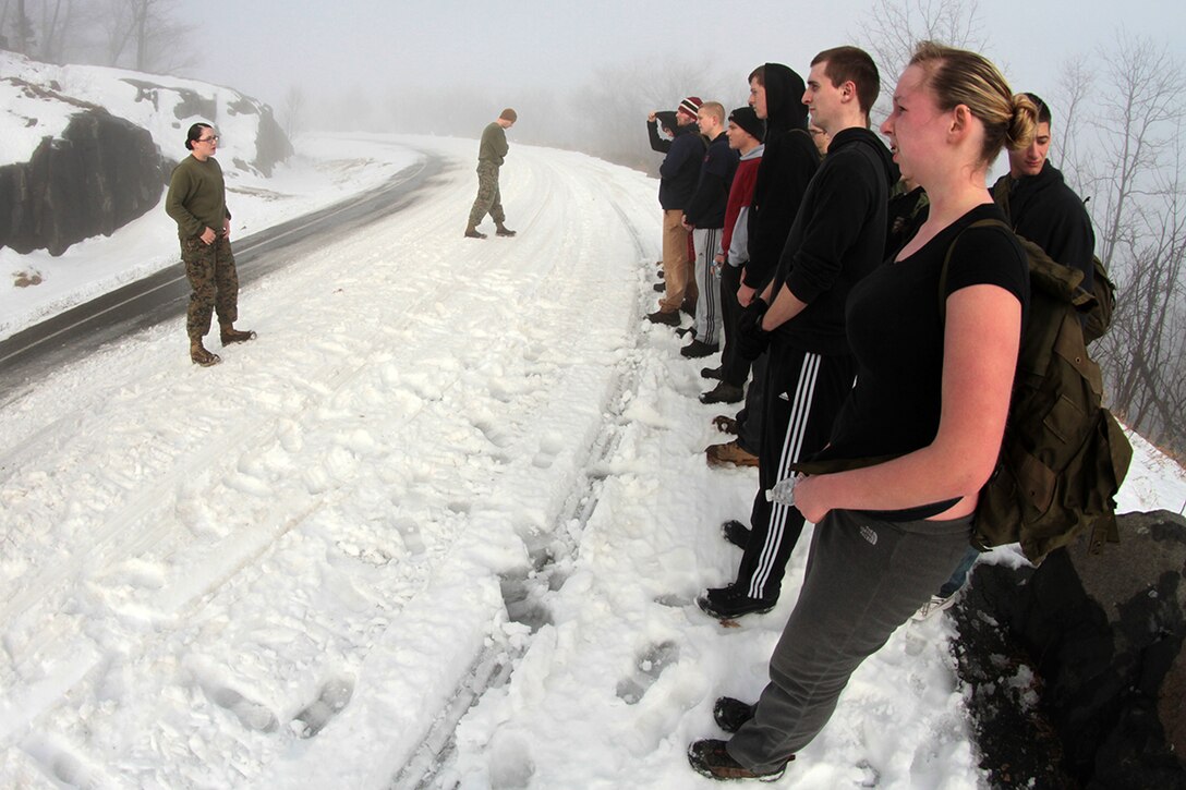 LAKE GEORGE, N.Y. -- Sergeant Cara J. Tighe, a 28-year-old recruiter at Recruiting Substation Saratoga Springs, Recruiting Station Albany, speaks to members of the station’s Delayed Entry Program during a conditioning hike up Prospect Mountain on January 12.  Tighe, who has been a recruiter since Nov. 2010, constantly meets with her poolees to ensure they continue to prepare for the rigors of recruit training.  Poolee is an informal title for a member of the DEP awaiting a shipping date to Marine Corps recruit training.  (U.S. Marine Corps photo by Sgt. Timothy T. Parish).