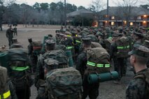 Sgt. Maj. Roger F. Griffith [top left], the sergeant major of Combat Logistics Battalion 6, 2nd Marine Logistics Group, speaks to Marines before starting squad challenges during an exercise aboard Camp Lejeune, N.C., Jan. 15, 2013. The troops performed exercises at 10 different checkpoints, where they challenged their minds and bodies with tasks such as push-ups, mountain climbers and burpees as well as assembling and disassembling machine guns. 