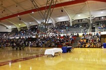 Servicemembers with 2nd Maintenance Battalion, Combat Logistics Regiment 25, 2nd Marine Logistics Group and their families gather in the Goettge Memorial Field House aboard Camp Lejeune, N.C., during a town hall meeting Jan. 14, 2013. The battalion’s leadership hosted the meeting so they could discuss the unit’s plans for the year. 