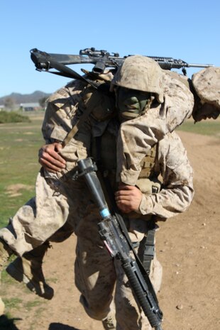 Pfc. Alberto Hernandez, Compay A, 1st Recruit Training Battalion, fireman carries another Marine during the Crucible at Edson Range aboard Marine Corps Base Camp Pendleton, Calif., Jan. 8. Before enlisting in the Marine Corps, Hernandez learned valuable life lessons which later helped him through recruit training.