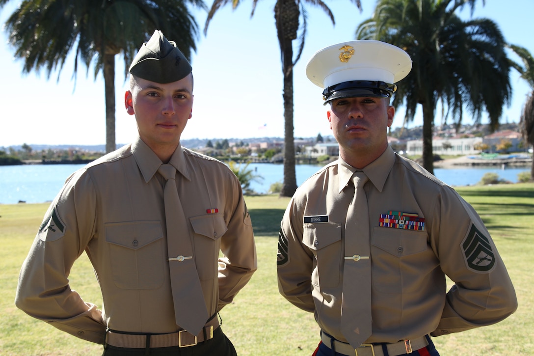 Lance Cpl. Adam Cardenas, honor graduate for Mike Company, stands with recruiter Staff Sgt. Robert Dorre, staff noncommissioned officer in charge, recruiting sub-station San Bernardino, Calif., during family day aboard Marine Corps Recruit Depot San Diego, Jan. 17. Cardenas was promoted to the rank of lance corporal due to his leadership skills, 1st class physical fitness test, 1st class combat fitness test and expert rifle score. 