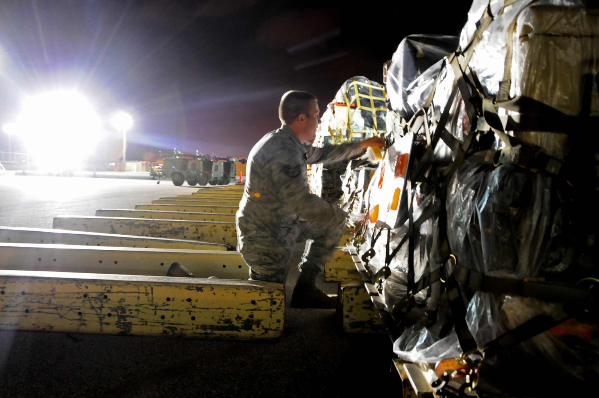 Staff Sgt. Scott Irwin, 644th Combat Communications Squadron cyber network operations supervisor, labels a pallet for transport in the aerial port during Operational Readiness Exercise Beverly Palm 13-01 at Andersen Air Force Base, Guam, Jan. 14, 2013. During Beverly Palm 13-01, executed from Jan. 13-16, Andersen practiced mobilization with Osan Air Base, South Korea. (U.S. Air Force photo by Airman 1st Class Marianique Santos/Released)