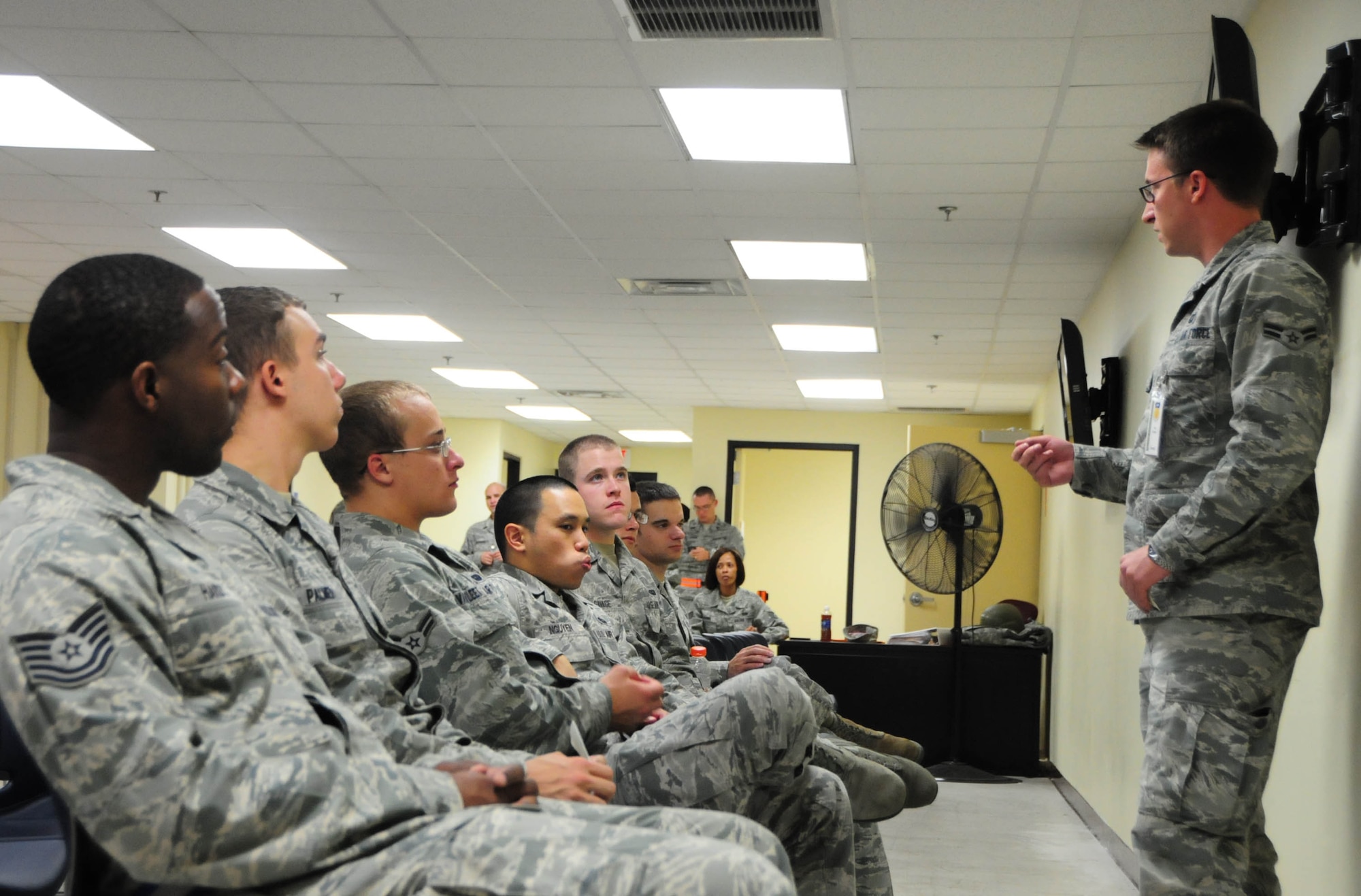 Airman 1st Class Justin Czarnecki, 36th Comptroller Squadron finance customer service technician, briefs outbound Airmen on possible financial concerns prior to their mock deployment during Operational Readiness Exercise Beverly Palm 13-01 on Andersen Air Force Base, Guam, Jan. 14, 2013. During Beverly Palm 13-01, executed from Jan. 13-16, Andersen practiced mobilization with Osan Air Base, South Korea. (U.S. Air Force photo by Airman 1st Class Marianique Santos/Released)