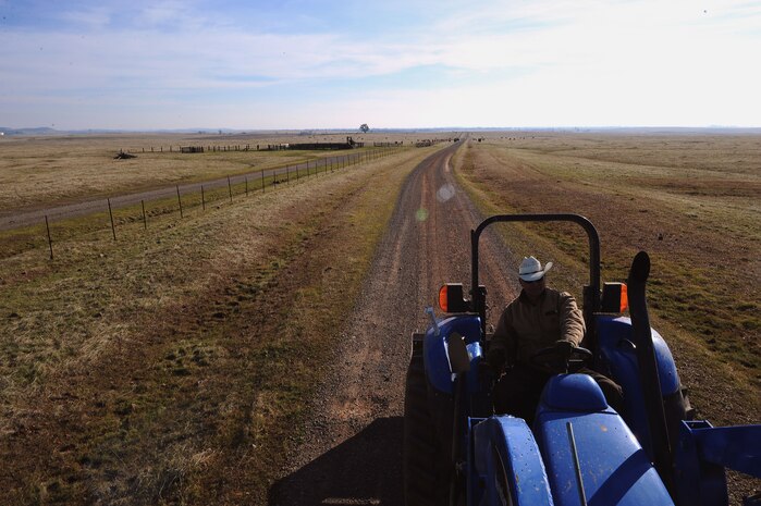 Ed Broskey, 9th Civil Engineering Squadron biological science technician, travels toward a cattle pasture Jan. 15, 2013, at Beale Air Force Base, Calif. Broskey is known as the "cowboy" on Beale and has the responsibility of maintaining fences, roads, watering systems and property. (U.S. Air Force photo by Senior Airman Shawn Nickel/Released)
