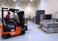 James Hollyfield, 50th Logistics Readiness Flight, uses a forklift to transport cargo Jan. 15 at the Secure Area Logistics Facility. The 50 LRF's mission is to conduct deployment planning, training and execution; base support planning, and logistics command and control in support of the Aerospace Expeditionary Force and Global Force Management construct. The flight performs logistics planning; manages the wing support agreements, mobility bags, deployment small-arms weapons, ammunition and transportation programs. (U.S. Air Force photo/Staff Sgt. Julius Delos Reyes)