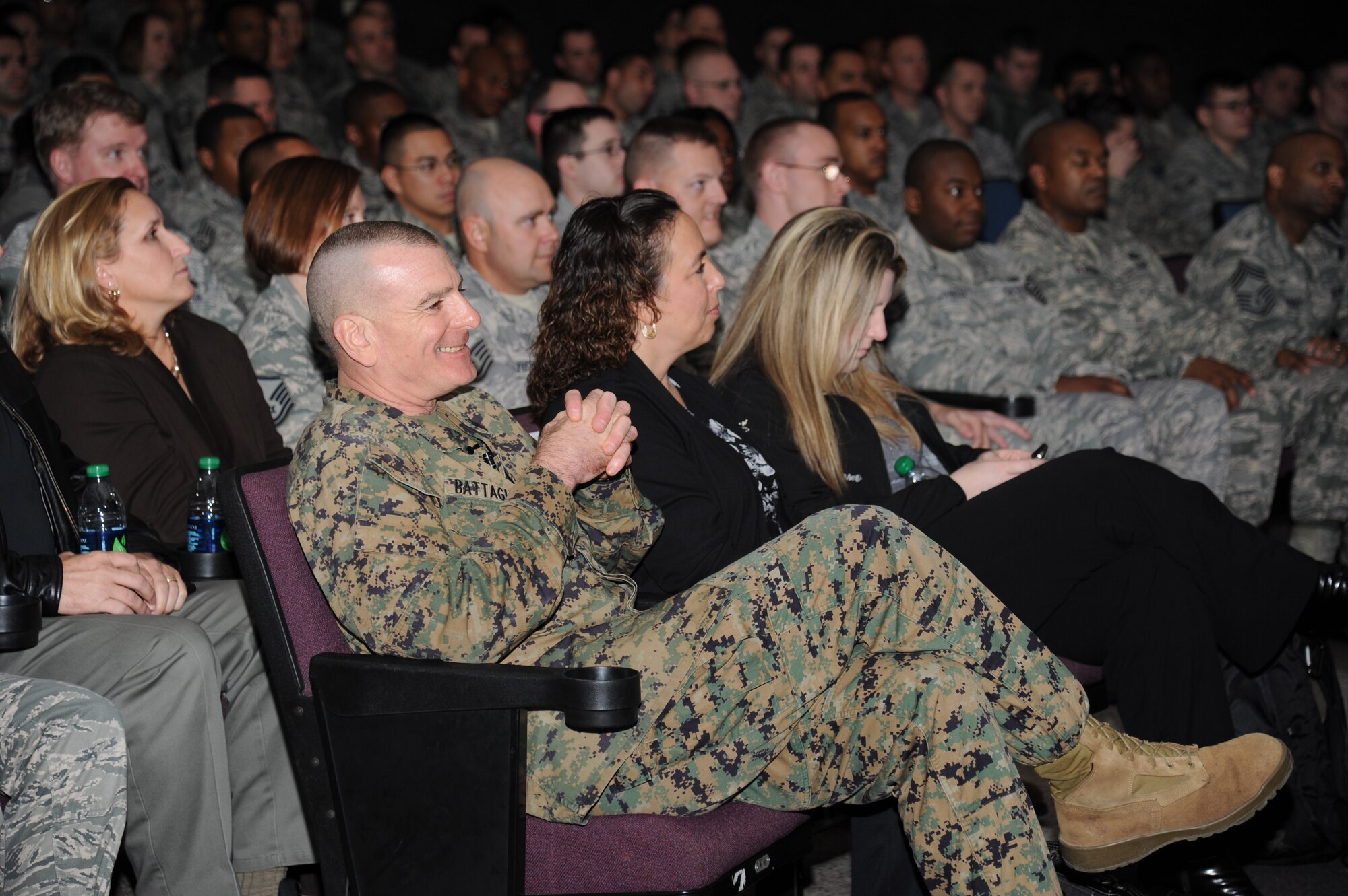 Marine Sgt. Maj. Bryan Battaglia, Senior Enlisted Advisor to the Chairman of the Joint Chiefs of Staff, waits in the audience as he is being introduced to speak during an enlisted call Jan. 16, 2013, at the Welch Theater, Keesler Air Force Base, Miss.  Battaglia’s one-day visit allowed him the opportunity to acquaint himself with Keesler’s people, mission and contribution to the bigger military picture.  He also talked to enlisted Keesler members about the CJCS’ four priorities, his own key themes and his thoughts on bridging the basics and total force fitness.  (U.S. Air Force photo by Kemberly Groue)