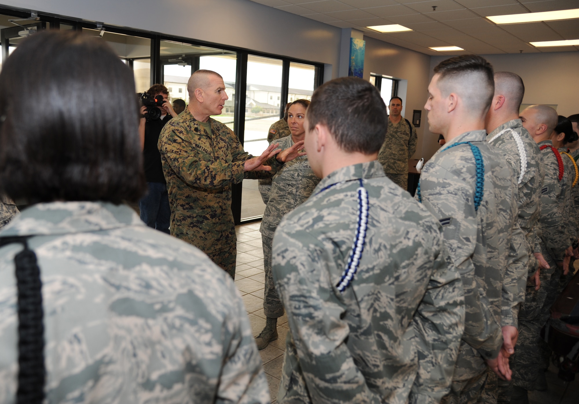 Marine Sgt. Maj. Bryan Battaglia, Senior Enlisted Advisor to the Chairman of the Joint Chiefs of Staff, learns about the 81st Training Group’s leadership rope program and the meaning behind the different colors with the assistance of Tech. Sgt. Julie Hammond, 81st TRG, Jan. 16, 2013, at the Levitow Training Support Facility, Keesler Air Force Base, Miss.  Battaglia’s one-day visit allowed him the opportunity to acquaint himself with Keesler’s people, mission and contribution to the bigger military picture.  He also talked to enlisted Keesler members about the CJCS’ four priorities, his own key themes and his thoughts on bridging the basics and total force fitness.  (U.S. Air Force photo by Kemberly Groue)