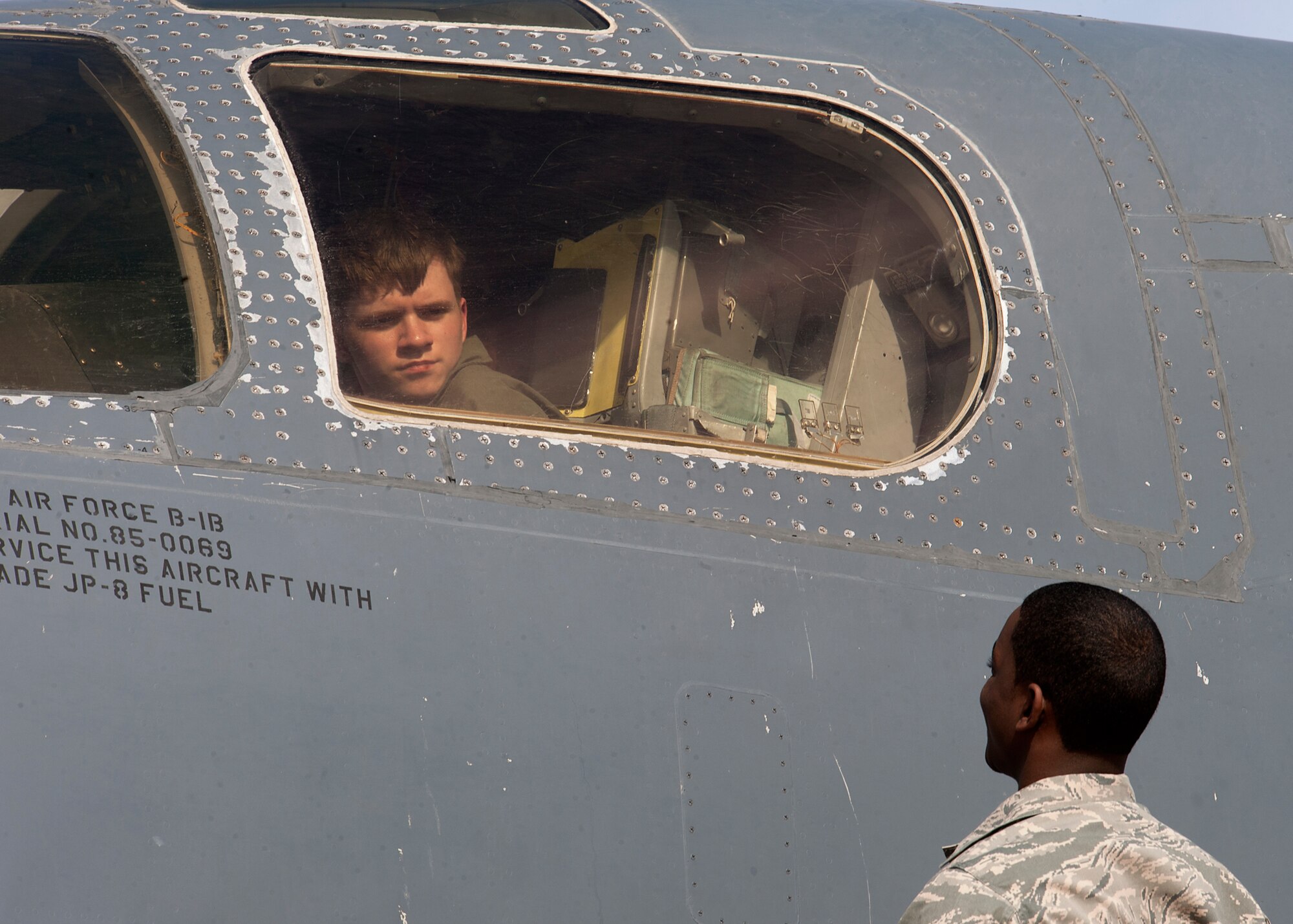 Keegan Vowell, 16-year-old Abilene resident, sits inside a B-1 Bomber during a “Pilot for a Day” tour Jan. 14, 2013, at Dyess Air Force Base, Texas. As part of the program, Keegan received his own flight suit, was demonstrated the capabilities of the 7th Security Forces K-9 Unit, toured the air traffic control tower, taxied a bomber, had his name put onto an aircraft, created his own Hollywood explosion with the 7th Civil Engineer Squadron Explosive Ordinance Disposal Unit and was presented a coin from the base commander. (U.S. Air Force photo by Airman 1st Class Damon Kasberg/ Released)