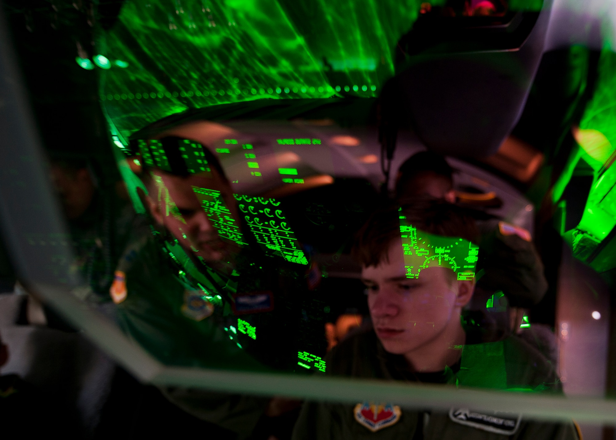 Keegan Vowell, 16-year-old Abilene resident, views the cockpit of a C-130J during a “Pilot for a Day” tour Jan. 14, 2013, at Dyess Air Force Base, Texas. As part of the program, Keegan received his own flight suit, was demonstrated the capabilities of the 7th Security Forces K-9 Unit, toured the air traffic control tower, taxied a bomber, had his name put onto an aircraft, created his own Hollywood explosion with the 7th Civil Engineer Squadron Explosive Ordinance Disposal Unit and was presented a coin from the base commander. (U.S. Air Force photo by Airman 1st Class Damon Kasberg/ Released)