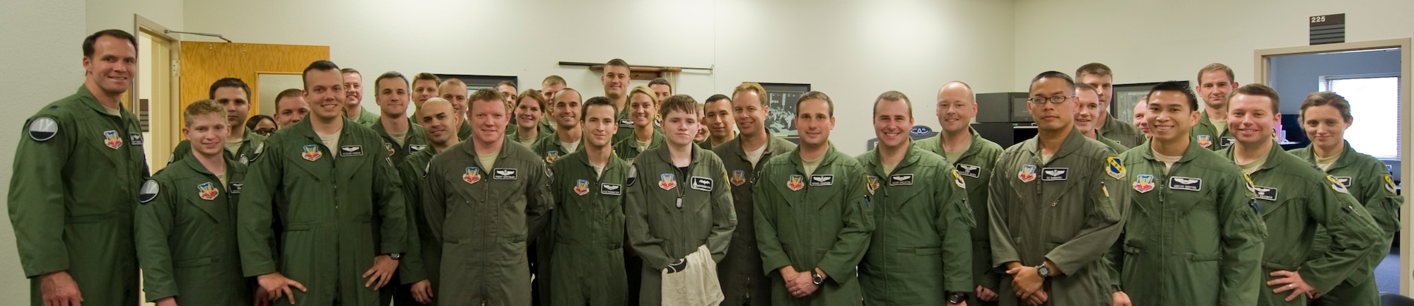 Keegan Vowell, 16-year-old Abilene resident, stands next to Airmen from the 9th Bomb Squadron during a “Pilot for a Day” tour Jan. 14, 2013, at Dyess Air Force Base, Texas. Throughout the event, Keegan received his own flight suit, was demonstrated the capabilities of the 7th Security Forces K-9 Unit, toured the air traffic control tower, taxied a bomber, had his name put onto an aircraft, created his own Hollywood explosion with the 7th Civil Engineer Squadron Explosive Ordinance Disposal Unit and was presented a coin from the base commander. (U.S. Air Force photo by Airman 1st Class Jonathan Stefanko/ Released)