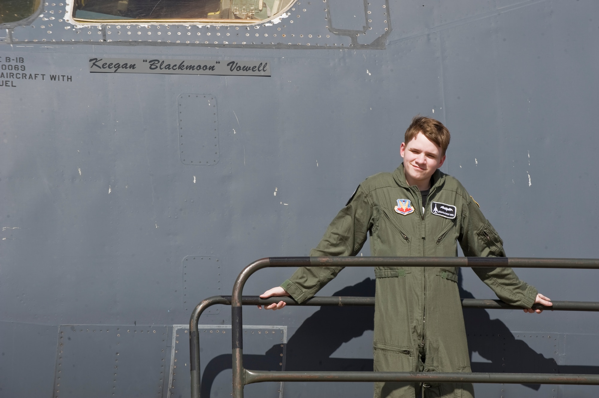 Keegan Vowell, 16-year-old Abilene resident, stands next to a B-1 Bomber with his name on it during a “Pilot for a Day” tour Jan. 14, 2013, at Dyess Air Force Base, Texas. Throughout the event, Keegan received his own flight suit, was demonstrated the capabilities of the 7th Security Forces K-9 Unit, toured the air traffic control tower, taxied a bomber, had his name put onto an aircraft, created his own Hollywood explosion with the 7th Civil Engineer Squadron Explosive Ordinance Disposal Unit and was presented a coin from the base commander. (U.S. Air Force photo by Airman 1st Class Jonathan Stefanko/ Released)