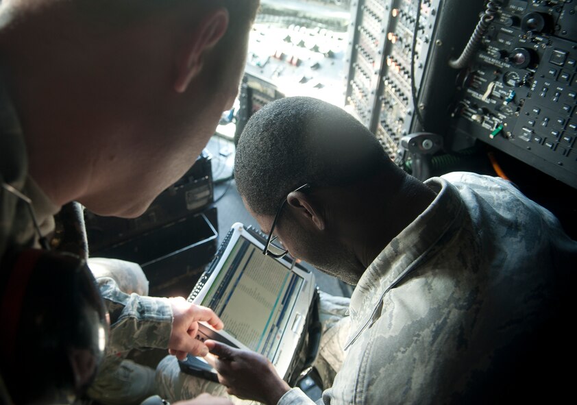 U.S. Air Force Tech. Sgt. Kenneth Bedgood, 372nd Training Squadron Det. 9 fuel system instructor, guides Staff Sgt. Andrew Thomas, 23d Maintenance Operations Squadron fuel system technician, during fuel training detachment  school at Moody Air Force Base, Ga., Jan. 16, 2013. FTD school is a 20-day course that qualifies Airmen in HC-130P Combat King fuel systems. (U.S. Air Force photo by Airman Paul Francis/Released) 
