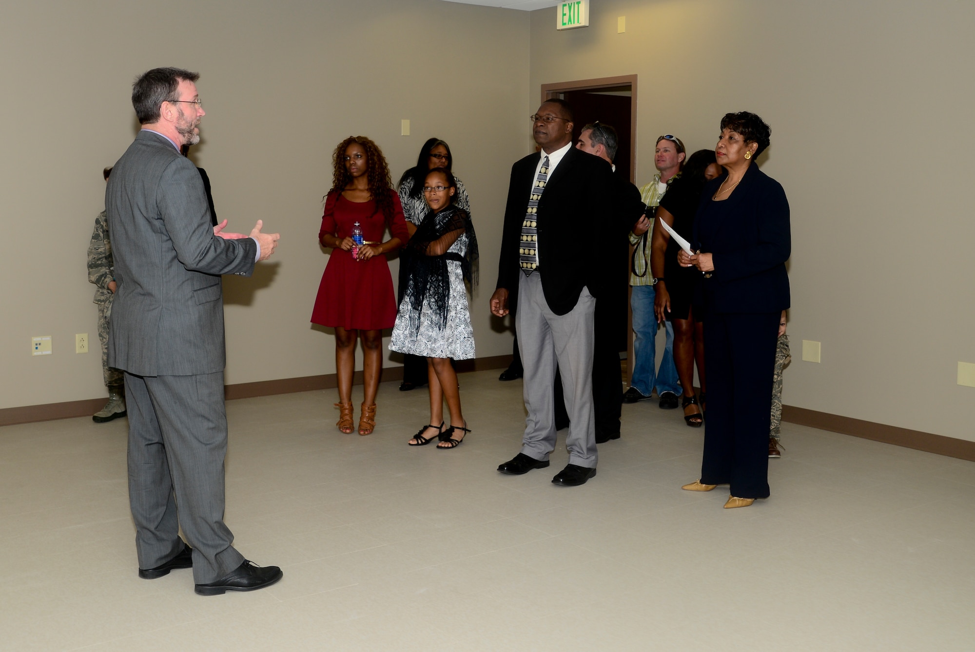 Richard Black, 6th Communication Squadron project officer, gives a tour of the new Consolidated Communication Facility, Estelle Hall, to the family of Maj. Raymond G. Estelle II who was killed in action in April 2011, at MacDill Air Force Base Fla., Jan. 16, 2013. The building will house the phone switch, technical control facility, network control center, client service center and nearly 100 personnel for the base. (U.S. Air Force photo by Senior Airman Melissa Paradise/Released)