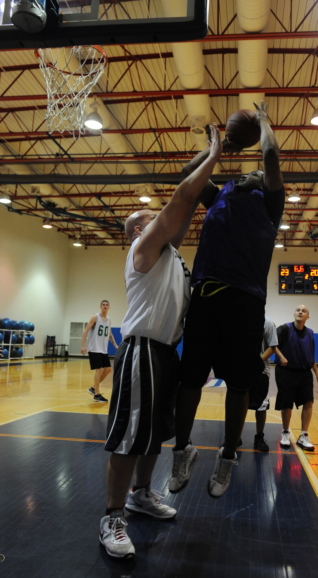WHITEMAN AIR FORCE BASE, Mo. -- Rashid Hill, 509th Logistics Readiness Squadron intramural basketball team member, goes for a layup against the 509th Aircraft Maintenance Squadron-B team at the Fitness Center, Jan. 10. LRS defeated the AMXS-B team 54-49. (U.S. Air Force photo/Airman 1st Class Bryan Crane)(Released)