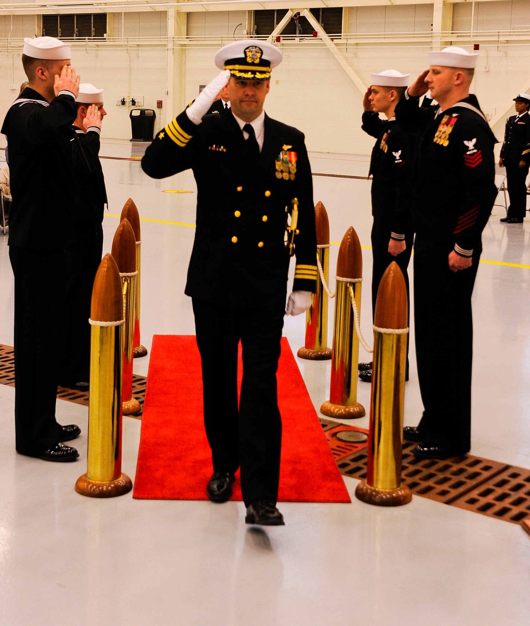 Cmdr. Trevor A. Blow, VR-64 commander, gets ‘piped aboard’ during the VR-64 change of command ceremony. Cmdr. Blow relieved Cmdr. Wayne D. Gunther to become the eighth commanding officer of VR-64 since its transition from Maritime Patrol to Fleet Logistics Support roles in September 2004. (U.S. Air Force photo by Airman 1st Class Ryan Throneberry/Released)
