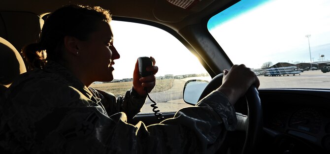 WHITEMAN AIR FORCE BASE, Mo. -- Airman 1st Class Heather Hall, 509th Operations Support Squadron airfield management coordinator, coordinates with the air traffic control tower to report a BASH threat, Jan. 9. Airfield management specialists engage with different agencies on base to ensure aircraft are protected from the risk of bird strikes at all times. (U.S. Air Force photo/Staff Sgt. Nick Wilson) (Released)
