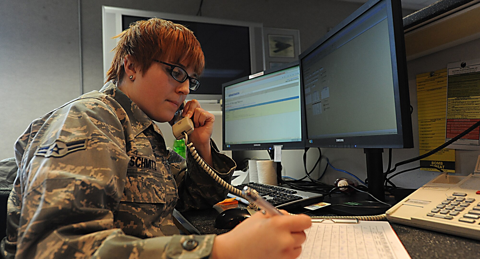 WHITEMAN AIR FORCE BASE, Mo. -- Airman 1st Class Hannah Schmitz, 509th Operations Support Squadron airfield management coordinator, receives a call from a supervisor informing her of a possible Bird Aircraft Strike Hazard, Jan. 9. Airfield management coordinators at Whiteman AFB keep the bird watch conditions updated and disperse about 50-100 species of birds. (U.S. Air Force photo/Staff Sgt. Nick Wilson) (Released)