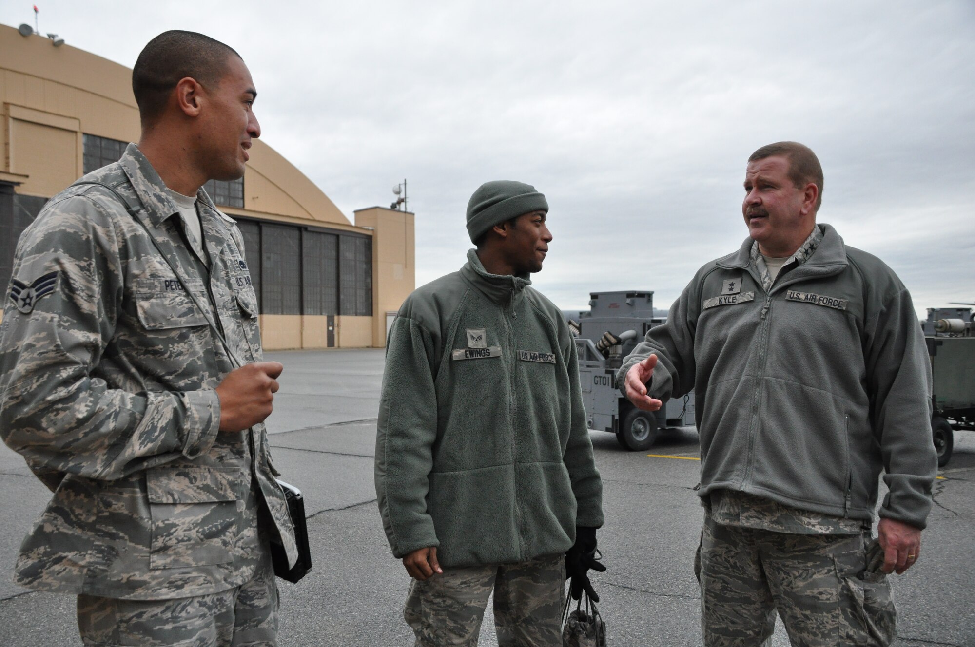Air Force Maj. Gen. Mark Kyle, commander of Fourth Air Force, talks with two Airmen from the 459th Maintenance Group on the flightline at Joint Base Andrews, Md., Jan. 14, 2013. Kyle visited the 459th Air Refueling Wing and met with the commander, Col. William Mason, to discuss effective ways to improve the unit. (U.S. Air Force photo/ Staff Sgt. Katie Spencer)