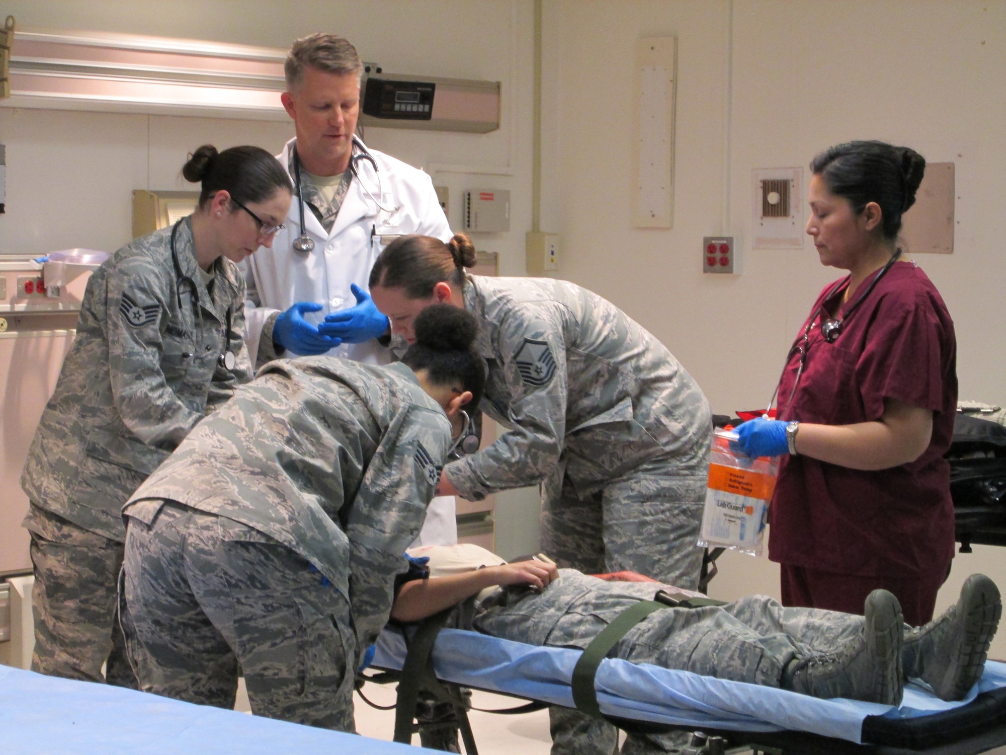 Col Christopher Scharenbrock oversees his team's care of a simulated trauma victim during a training held at Joint Base Andrews January 10, 2013. The training is to ensure the medical team is ready to be part of the 57th Presidential Inauguration as a medical response unit. Scharenbrock is an emergent care physician with the 79th Medical Wing. (U.S. Air Force Photo/Melanie Moore)