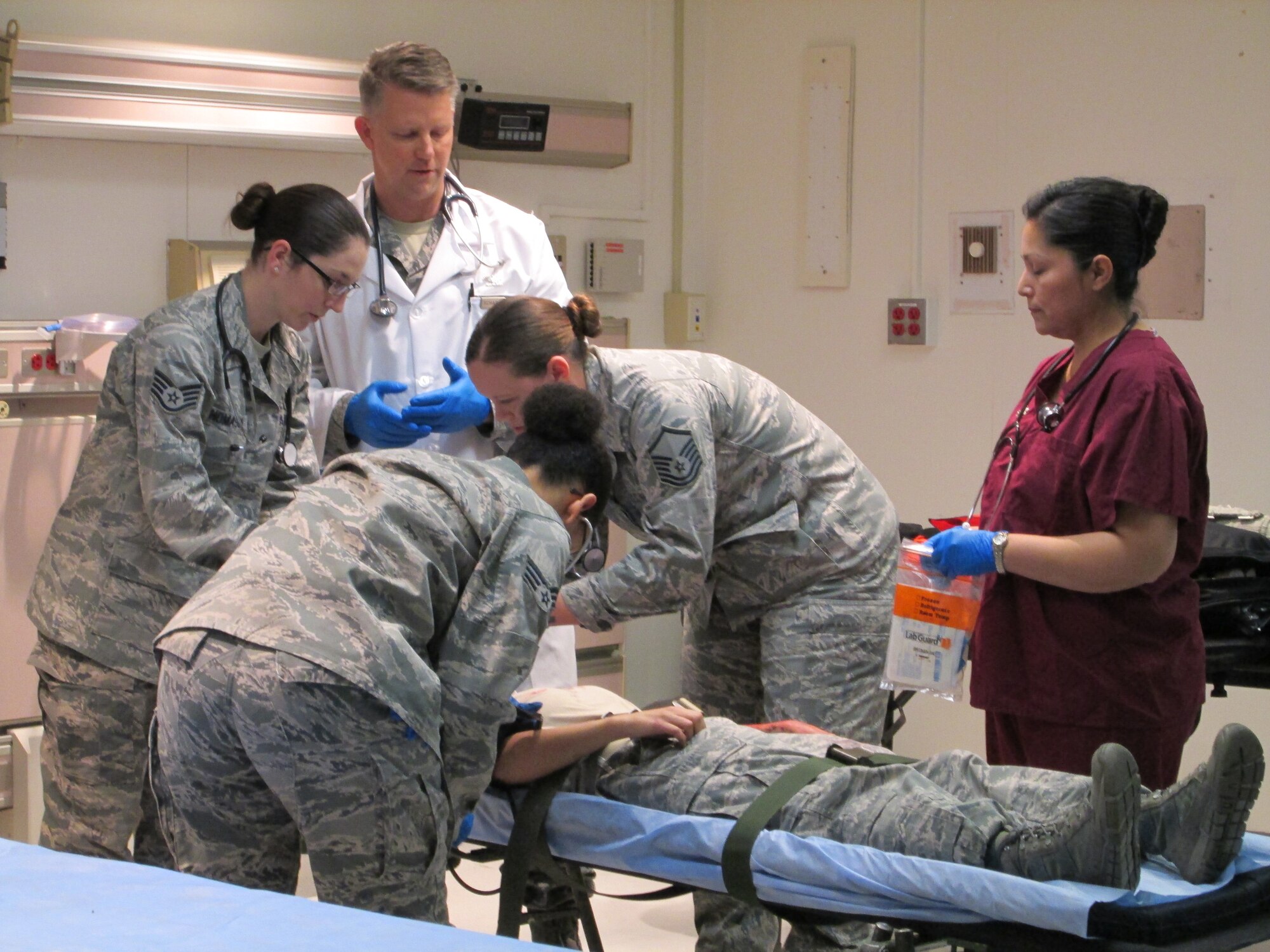 Col Christopher Scharenbrock oversees his team's care of a simulated trauma victim during a training held at Joint Base Andrews January 10, 2013. The training is to ensure the medical team is ready to be part of the 57th Presidential Inauguration as a medical response unit. Scharenbrock is an emergent care physician with the 79th Medical Wing. (U.S. Air Force Photo/Melanie Moore)