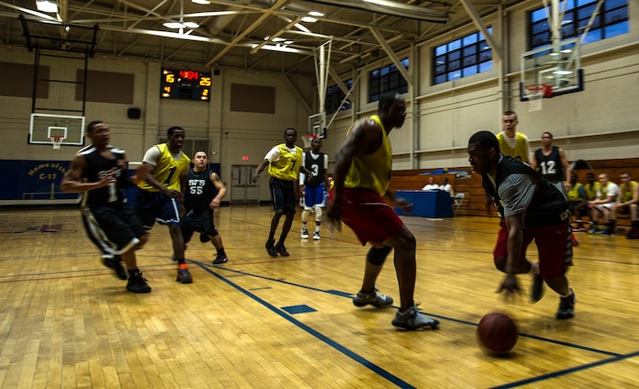 Keith Garrett, 628th Security Forces Squadron, drives the baseline to the basket Jan. 15, 2013, at Joint-Base Charleston, S.C.  628th LRS beat the 628th Security Forces Squadron by a score of 59 to 49 in the season opener of the 2013 intramural season. (U.S. Air Force photo/Staff Sgt. Rasheen Douglas)
