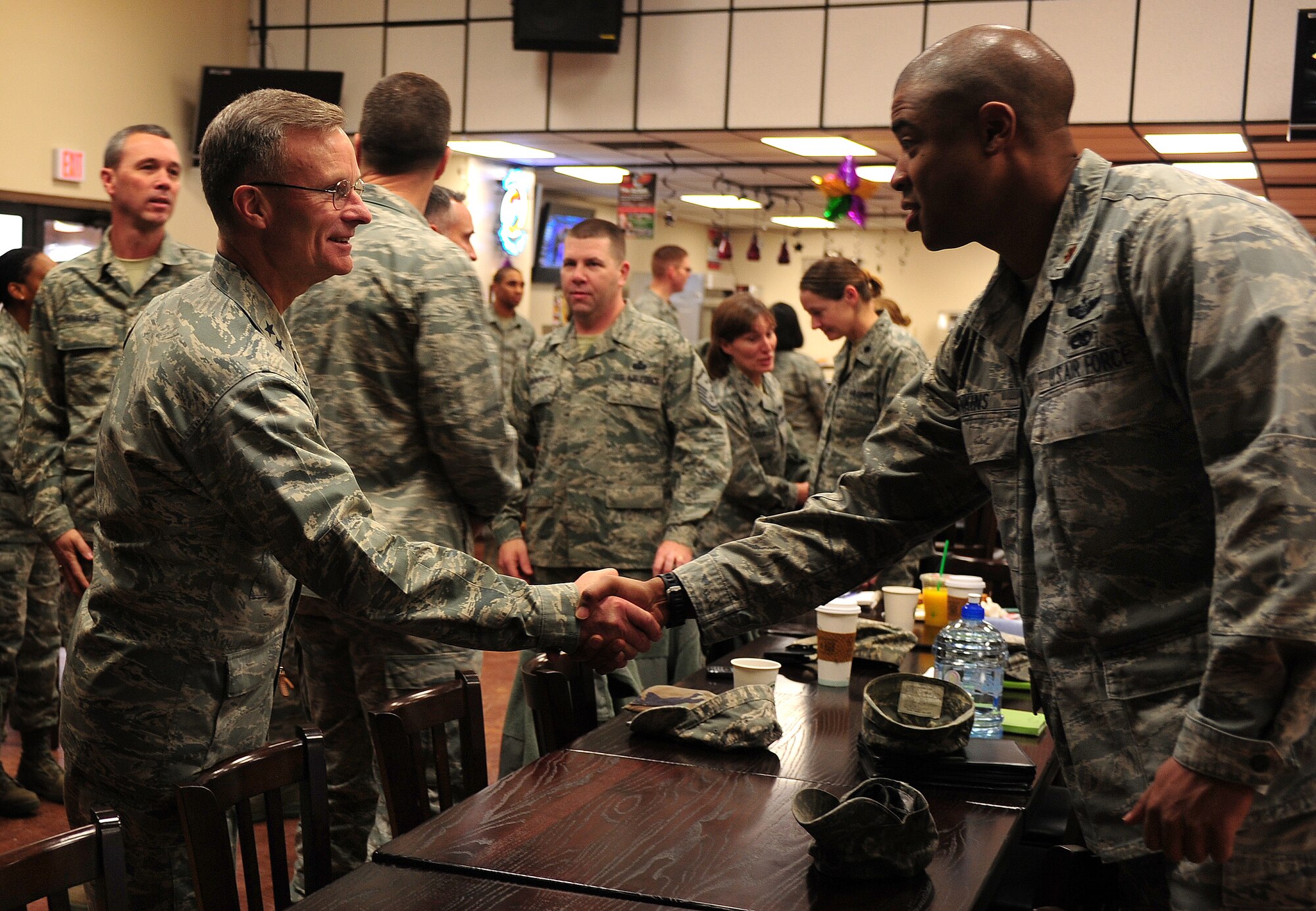 U.S. Air Force Maj. Gen. Steven J. Lepper, Headquarters U.S. Air Force Deputy Judge Advocate General, shakes hands with commanders and first sergeants while attending a breakfast meeting at Cannon Air Force Base, N.M., Jan. 16, 2013. Lepper visited Cannon to perform a follow-up inspection after the consolidated unit inspection held July 2012. (U.S. Air Force photo/Airman 1st Class Ericka Engblom)