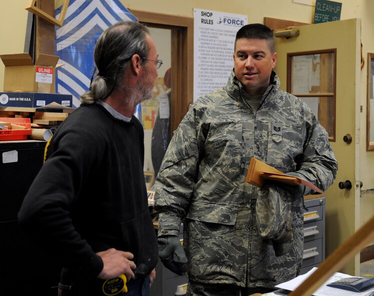 Mike Jarrett, 2nd Force Support Squadron wood craft shop, speaks with a customer on Barksdale Air Force Base, La., Jan. 16. The wood craft shop receives more than 30 requests a month ranging from shadow boxes to trophy shelves for retirements and other occasions. (U.S. Air Force photo/Airman 1st Class Benjamin Gonsier)