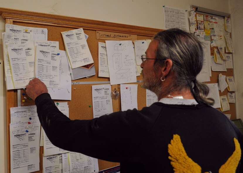 Mike Jarrett, 2nd Force Support Squadron wood craft shop, looks through work requests on Barksdale Air Force Base, La., Jan. 16. The wood craft shop receives more than 30 requests a month ranging from shadow boxes to trophy shelves. (U.S. Air Force photo/Airman 1st Class Benjamin Gonsier)