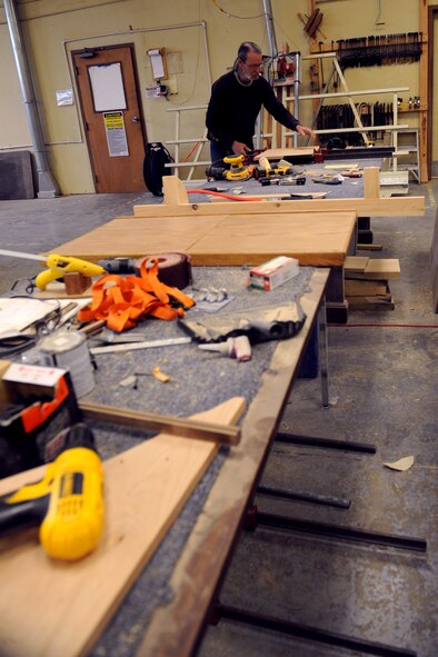 Mike Jarrett, 2nd Force Support Squadron wood craft center, glues two pieces of wood together on Barksdale Air Force Base, La., Jan. 16. The wood craft shop makes shadow boxes, podiums, trophy cases and coin racks. (U.S. Air Force photo/Airman 1st Class Benjamin Gonsier)