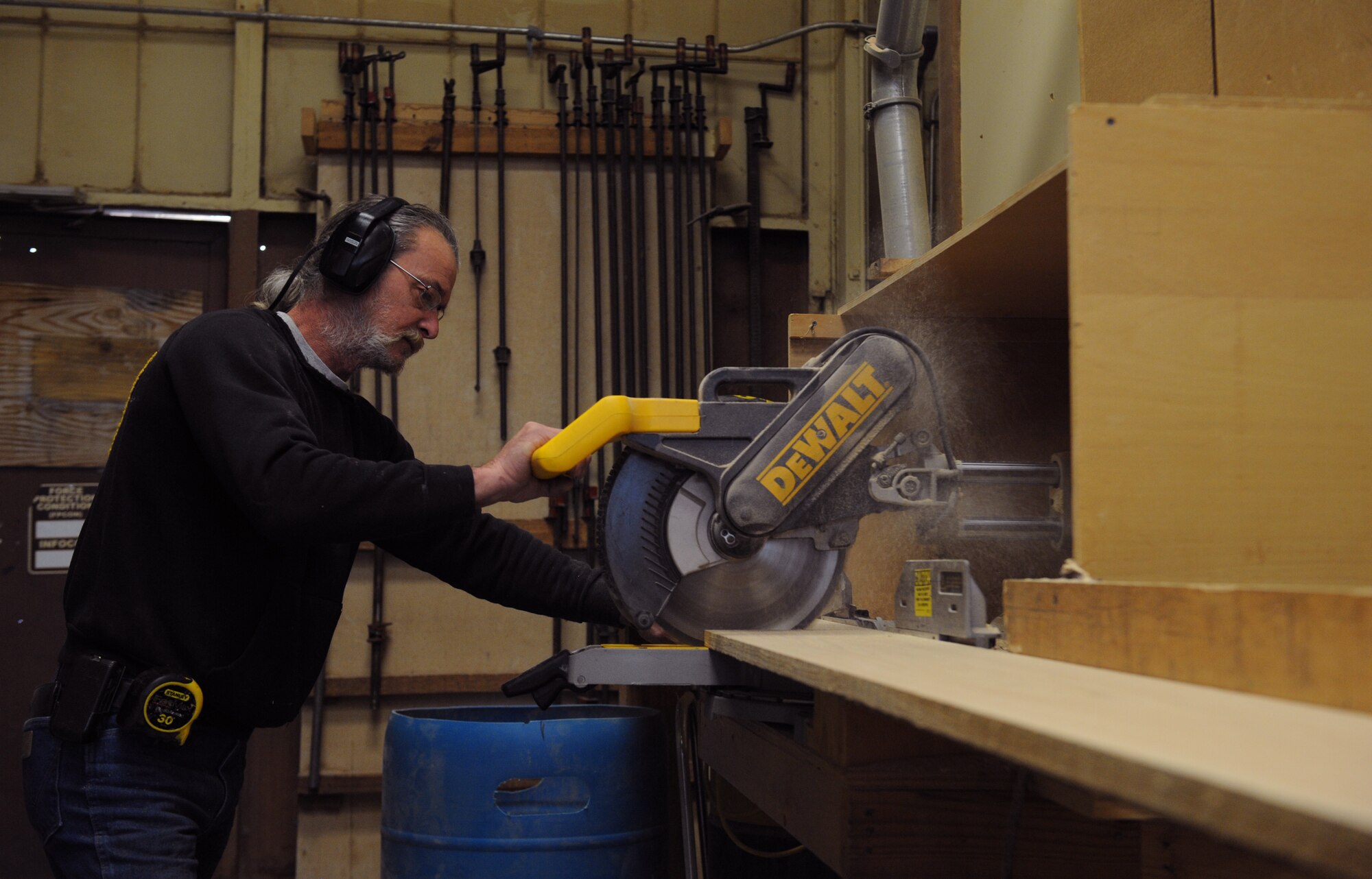 Mike Jarrett, 2nd Force Support Squadron wood craft shop, cuts a piece of lumber on Barksdale Air Force Base, La., Jan. 16. The wood craft shop makes shadow boxes, podiums, trophy cases and coin racks. Every month, the wood craft shop offers a four-day woodworking class where beginners can be certified to use the shop's equipment. (U.S. Air Force photo/Airman 1st Class Benjamin Gonsier)
