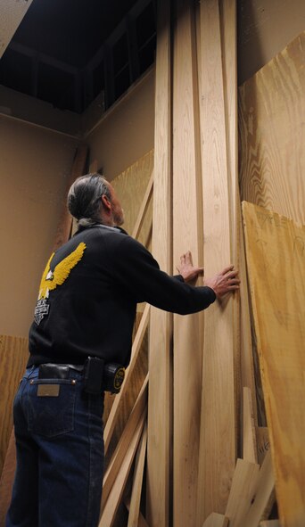 Mike Jarrett, 2nd Force Support Squadron wood craft shop, looks for a piece of lumber for a wood project on Barksdale Air Force Base, La., Jan. 16. The wood craft shop contains a large variety of hard wood including pine, oak, cherry, walnut, maple and ash. (U.S. Air Force photo/Airman 1st Class Benjamin Gonsier)