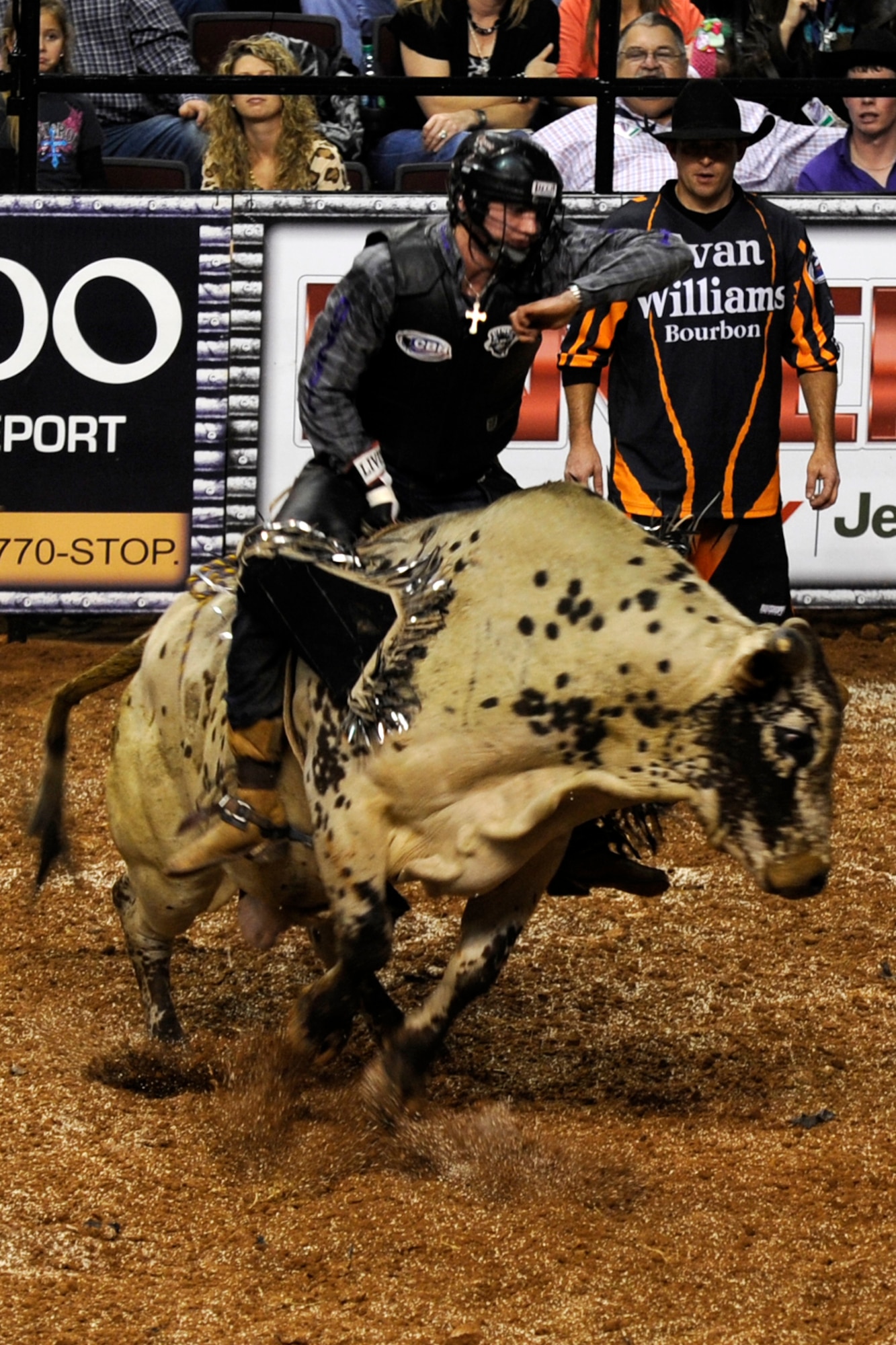 Cody Teel, from Kountze, Texas, monitors his own time during the Tuff Hedeman Louisiana Shootout at the Centurylink Center in Bossier City, La., Jan. 12, 2013. Teel won the bull riding competition with a score of 90, pocketing $14,000 in prize money. The Centurylink Center hosts numerous entertainment and sporting events throughout the year with some offering discounts to military personnel. For a young Barksdale Airman who can’t afford a car payment, a round-trip cab ride to the Centurylink Center is approximately 20 dollars for a safe and exciting night off base. It was listed as one of the Top 100 Venues for Worldwide Ticket Sales for Mid-Year 2012 by Pollstar Magazine. It was ranked 67th in the world and 34th in the United States. (U.S. Air Force photo by Master Sgt. Jeff Walston)