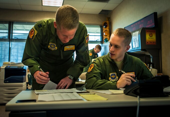 Capt. James Hesson, 16th Airlift Squadron C-17 pilot, and 1st Lt. Joshua Bohun, 16th AS C-17 pilot, are planning upcoming mission schedules Jan. 16, 2013 at Joint Base Charleston – Air Base, S.C. (U.S. Air Force photo / Airman 1st Class Tom Brading)