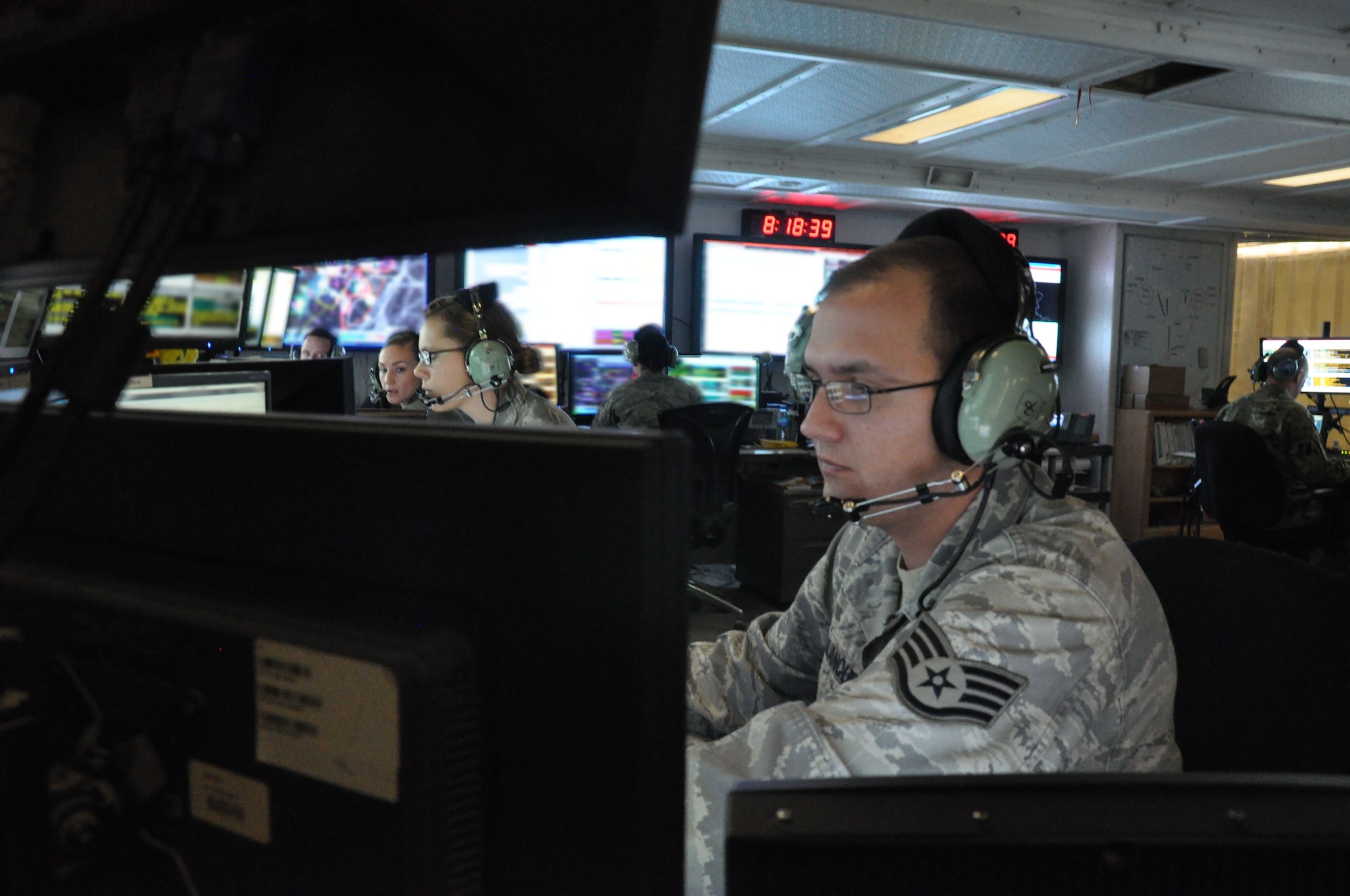 Senior Airman Gavin Lowery, Tech. Sgt. Brandi Cowden, Senior Airman Hailey Sundberg and Staff Sgt. Eric Kalanquin deconflict coalition airspace, Jan. 9. The 71st Expeditionary Air Control Squadron monitors airspace throughout the coalition area of responsibility in Southwest Asia and serve as a failsafe measure for other forward air monitoring services. The outgoing rotation is the final group of air surveillance professionals from Aviano Air Base, Italy, and will return home soon.  (U.S. Air Force photo/Master Sgt. Christian Michael)