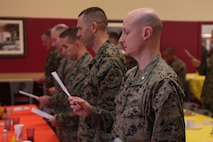 Lt. Col. Jesse A. Kemp, the commanding officer of 2nd Supply Battalion, and other members of 2nd Marine Logistics Group sing “Lift Every Voice and Sing” during a breakfast held in honor of the Rev. Martin Luther King Jr. at a mess hall aboard Camp Lejeune, N.C., Jan. 17, 2013. The group’s chaplains organized the prayer breakfast in honor of King’s work in the civil rights movement and how it relates to the Marine Corps’ core values of honor, courage and commitment. 