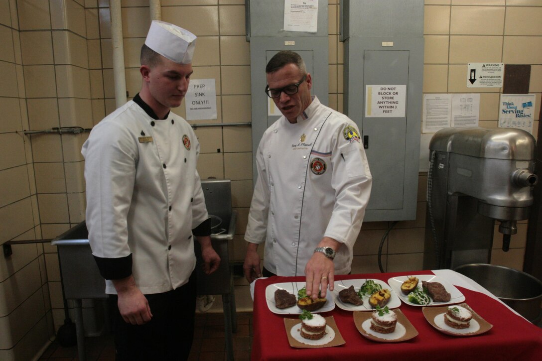 Cpl. Brandon Bower, a food service specialist with Headquarters and Headquarters Squadron, presents his meal to the judges, from left to right, Aida Watson, an air station human resources specialist; Sgt. Maj. Larry Harrington, Marine Transport Squadron 1; and Sgt. Maj. Holly Prafke, Headquarters and Headquarters Squadron, during the Chef of the Quarter competition at the Cherry Point mess hall Jan. 10.