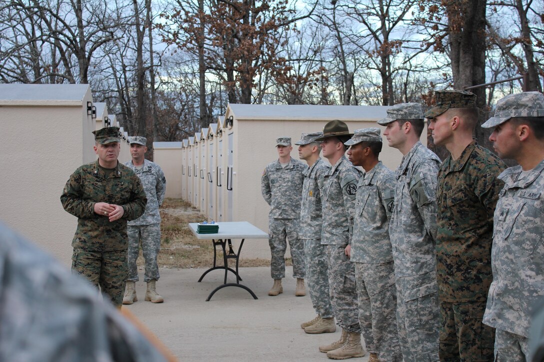 Colonel John R. Giltz speaking at the third quarter Best Warrior Competition presentation ceremony as the guest of honor on January 8, 2013.