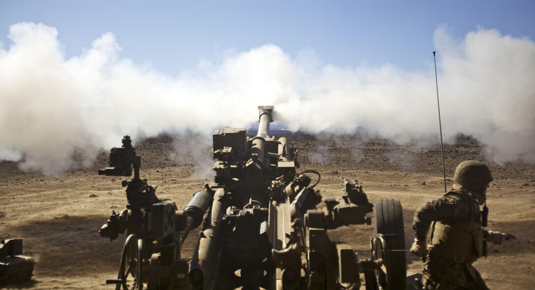 POHAKULOA TRAINING AREA, Hawaii  - Gunnery Sgt. Gustavo Faran, 1st Battalion, 12th Marine Regiment, assistant battalion truck master and native of Meriden, Conn., pulls the lanyard cord of a M777A2 155 mm light howitzer and sends a shell downrange during a firing mission for Operation Spartan Fury, Dec. 4. (Official U.S. Marine Corps photo by Cpl. James A. Sauter)