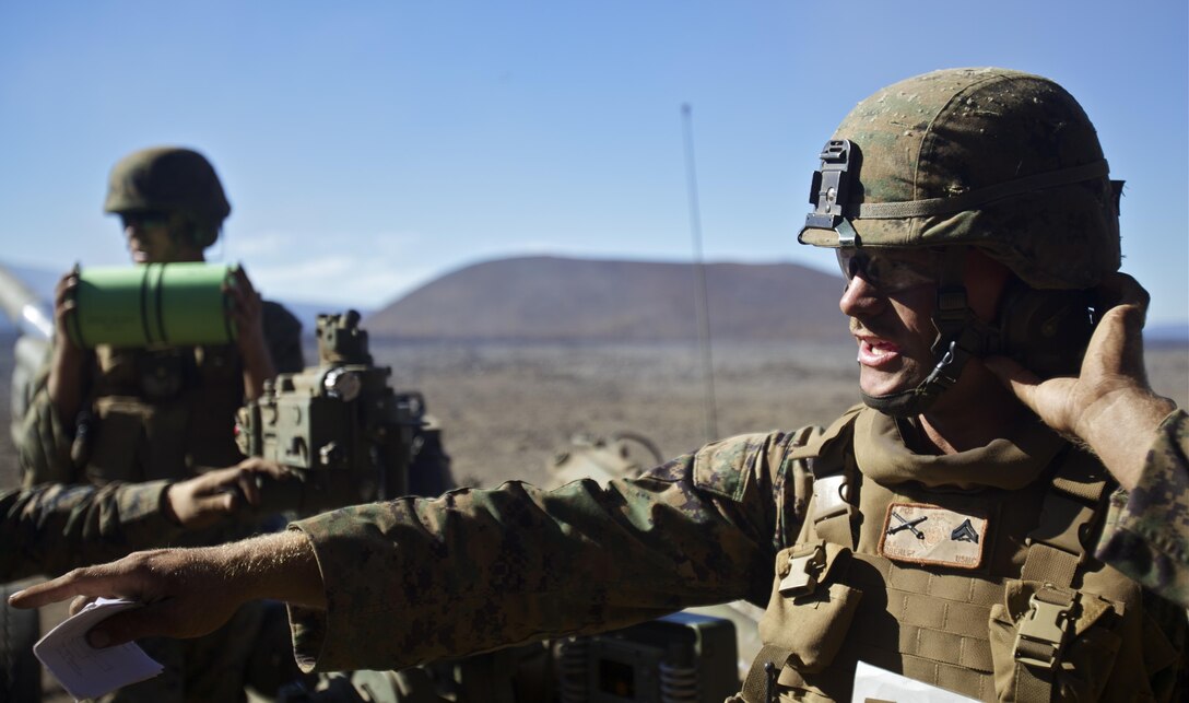 POHAKULOA TRAINING AREA  - Cpl. Michael Oberley, 1st Battalion, 12th Marine Regiment section chief and native of Greeley, Colo., gives instructions to the Marines of his gun section after receiving an order to prepare for a firing mission during a training exercise for Operation Spartan Fury, Dec. 4. (Official U.S. Marine Corps photo by Cpl. James A. Sauter)