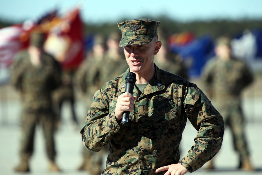 Lt. Col. Justin W. Knox, commanding officer of Marine Fighter Attack Squadron 115,  addresses an audience during a change of command ceremony held at VMFA-115's hangar aboard Marine Corps Air Station Beaufort, Jan. 18. Lt. Col. Matthew H. Phares relinquished command of VMFA-115 to Knox who was previously serving as the squadron's executive officer.
