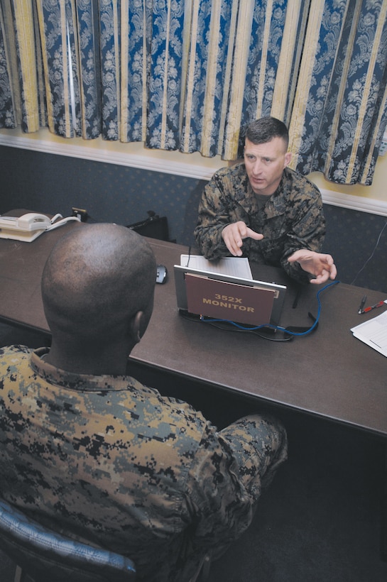 Sgt. Irvin Stalls, left, license examiner, Fleet Support Division, Marine Corps Logistics Command, meets with Master Sgt. Sean M. Weeks, motor transportation maintenance monitor, Headquarters Marine Corps, Quantico, Va., during a Headquarters Manpower Management Enlisted Assignment visit held at the Base Conference Center, Jan. 10.