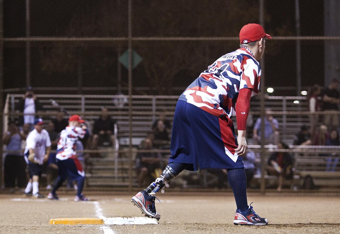 WAIPAHU - Retired Lance Cpl. Tim Horton, a native of Sulphur Springs, Texas, who lost the lower part of his left leg while serving in Iraq, prepares to run toward second base during a softball game at the Central Oahu Softball Complex, Jan. 9. The team, comprised of 14 active duty and retired Marines and soldiers, play despite amputations they sustained while supporting combat operations in Afghanistan and Iraq. They bombarded their opponents, Honolulu Veterans Affairs, with line drives and home runs to finish on top, 20-8. (Official U.S. Marine Corps photo by Lance Cpl. Nathan Knapke)