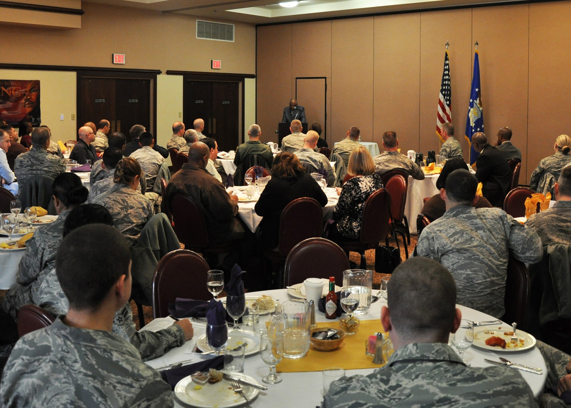A varied audience of Airmen and civilians listen to Dr. Joseph L. Slade, the guest speaker for the annual Dr. Martin Luther King, Jr. Observance Day Breakfast. The event occurred at the Recce Point Club on Beale Air Force Base Calif., Jan. 18, 2013.  Slade is a leading authority of gospel music and has preached, lectured and conducted many choirs and workshops in churches and conventions throughout the nation.  (U.S. Air Force photo by Airman First Class Bobby Cummings/Released)