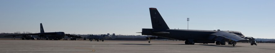 B-52H Stratofortress bombers sit on the flightline as an A-10 Thunderbolt II taxis on Barksdale Air Force Base, La., Jan. 18. For the past 60 years the B-52 has been a mainstay of the Air Force?s bomber force by providing the capability to strike from anywhere in the world and deliver precision munitions to the battlefield. (U.S. Air Force photo/Airman 1st Class Andrew Moua)