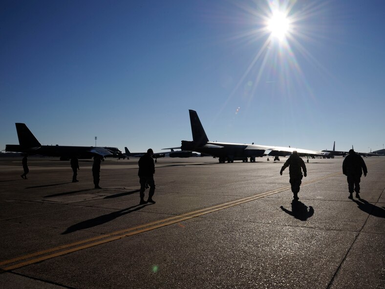 Airmen assigned to the 20th Aircraft Maintenance Squadron, conduct a foreign object debris walk on the flightline at Barksdale Air Force Base, La., Jan. 18. The 20 AMU conducts FOD walks at least three times a week to clean the flightline of objects or material that could pose a threat to aircraft. (U.S. Air Force photo/Airman 1st Class Andrew Moua)