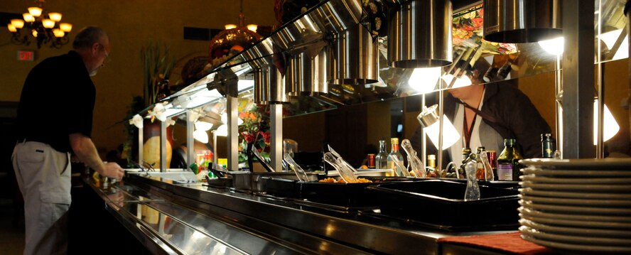 Tony Flowers, Barksdale Club manager, tidies up the salad bar at the Barksdale Club on Barksdale Air Force Base, La., Jan. 17. The Barksdale Club recently underwent renovations which rearranged the seating and set up of the club's dining areas. With more than 120 salad bar items to choose from, the club has many more food choices for lunch between 11 a.m. and 1 p.m. (U.S. Air Force photo/Airman 1st Class Andrew Moua)