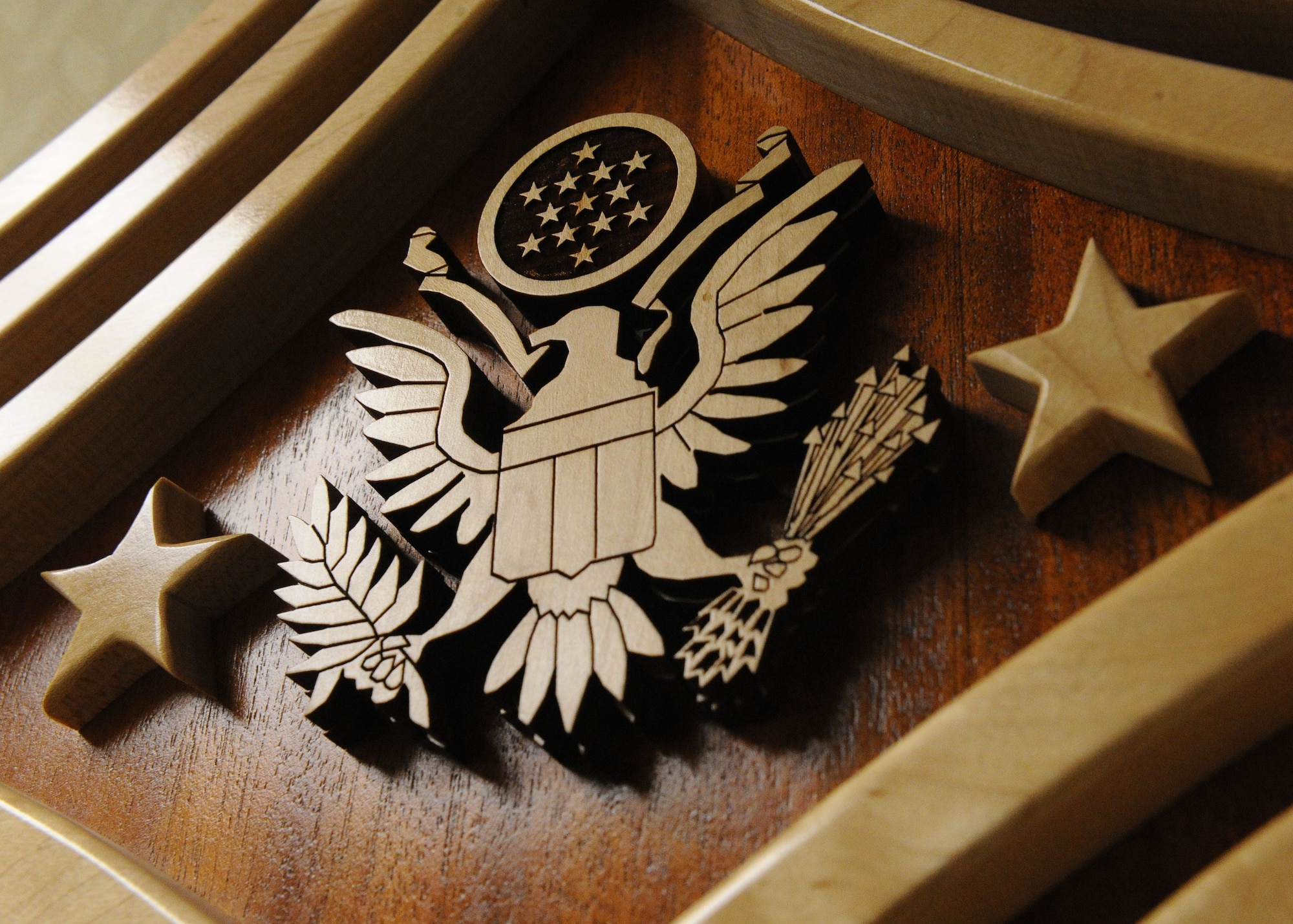 The chief master sgt. of the Air Force insignia hangs in the hallways of the Binnicker Professional Military Education Center at Joint Base Pearl Harbor-Hickam, Hawaii.  The CMSAF is the senior enlisted member of the Air Force and takes precedence over all enlisted member while serving in the position. (U.S. Air Force photo/Tech. Sgt. Jerome S. Tayborn)