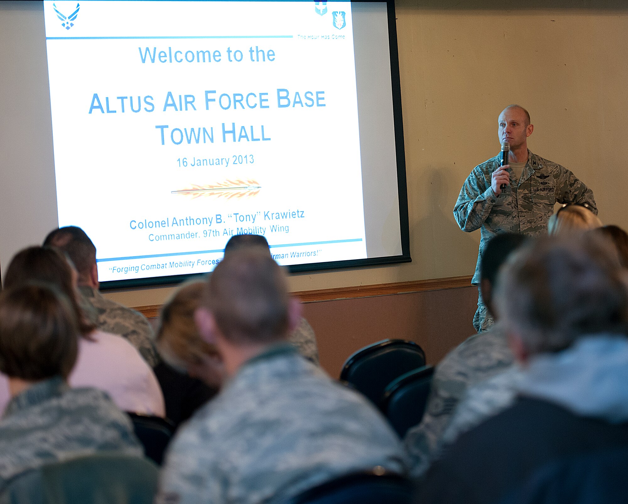ALTUS AIR FORCE BASE, Okla. – Col. Anthony Krawietz, 97th Air Mobility Wing commander, speaks during a town hall meeting at Club Altus, Jan 16. The town hall was held to ensure critical information pertaining to base residences, employees and service members was provided. Topics of discussion included the Commissary, Army Air Force Exchange Service installation establishments, future base construction, and overall quality of life for Altus AFB. (U.S. Air Force photo by Senior Airman Jesse Lopez/Released)