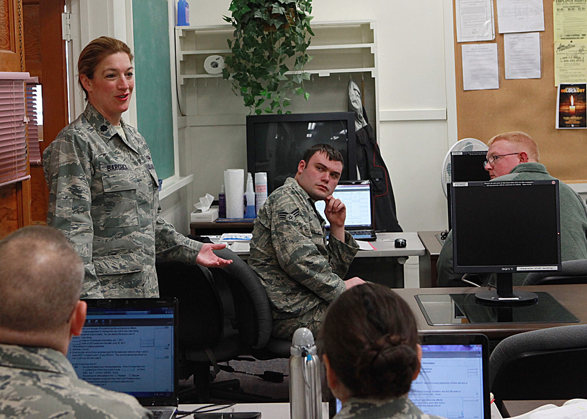 Lt. Col. Laura Barchick, 90th Missile Wing Staff Judge Advocate, speaks to members of the tax preparation team at the Education center as they participate in a training class to prepare for the upcoming tax season. (U.S. Air Force photo by Matt Bilden)