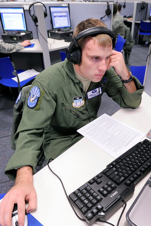 Cadet 1st Class Derek Travis reviews instructions for filling out a security clearance questionaire in the Air Force Academy's foreign language lab Jan. 12, 2013. The Academy's Information Protection office processes between 650 and 700 applications for top secret clearance annually. Travis is assigned to Cadet Squadron 33. (U.S. Air Force photo/Mike Kaplan)